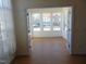 Bright sunroom with multiple windows and hardwood floors at 4712 Fox Fern Ln, Raleigh, NC 27604