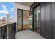 Balcony showcasing views of the city skyline with glass doors to the interior at 523 S West # 305, Raleigh, NC 27601