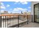 Balcony view overlooking the city skyline with blue sky and scattered clouds at 523 S West # 305, Raleigh, NC 27601