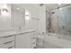 Bright bathroom featuring a shower-over-tub with gray tiling and a white vanity with a large mirror at 523 S West # 305, Raleigh, NC 27601