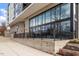 Exterior of a modern building with large windows, brick accents, and outdoor landscaping at 523 S West # 305, Raleigh, NC 27601