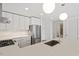 Spacious kitchen featuring stainless steel appliances, modern lighting, and white cabinets at 523 S West # 305, Raleigh, NC 27601