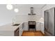 Bright kitchen featuring white countertops, stainless steel appliances, and modern pendant lighting at 523 S West # 305, Raleigh, NC 27601