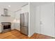 Modern kitchen featuring stainless steel appliances, white cabinets, and wood flooring at 523 S West # 305, Raleigh, NC 27601