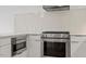 Modern kitchen featuring stainless steel appliances, backsplash, and light countertops at 523 S West # 305, Raleigh, NC 27601