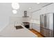 Well-lit kitchen featuring stainless steel appliances, white countertops, and modern lighting at 523 S West # 305, Raleigh, NC 27601