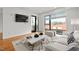 Bright living room with modern decor, large windows, and hardwood floors at 523 S West # 305, Raleigh, NC 27601