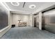 Modern lobby area with elevator access, seating and table decor at 523 S West # 305, Raleigh, NC 27601