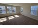 Bright bedroom featuring neutral walls, carpet and large windows offering plenty of natural light at 6328 Granite Quarry Dr, Raleigh, NC 27610