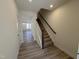Welcoming foyer with view of staircase and spacious living area flooded with natural light at 6328 Granite Quarry Dr, Raleigh, NC 27610