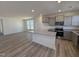 Contemporary kitchen features gray cabinets, granite counters, and stainless steel appliances at 6328 Granite Quarry Dr, Raleigh, NC 27610