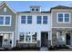 Charming townhome showcases stone accents and light-filled windows on a sunny day at 6330 Granite Quarry Dr, Raleigh, NC 27610