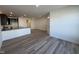 Open concept living room and kitchen featuring hardwood floors at 6330 Granite Quarry Dr, Raleigh, NC 27610