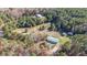 Aerial view of house and expansive property with mature trees at 754 Firestone Ln, Sanford, NC 27330