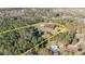 Aerial view of property showing home and outbuildings at 754 Firestone Ln, Sanford, NC 27330