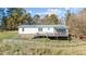 Home's back deck overlooks a large backyard at 754 Firestone Ln, Sanford, NC 27330