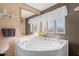Corner bathtub is the centerpiece of this clean bathroom at 754 Firestone Ln, Sanford, NC 27330