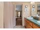 Bathroom boasts dual sinks, a shower, and a view into a bedroom at 754 Firestone Ln, Sanford, NC 27330