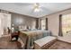 Bright bedroom featuring a king-size bed and ample natural light at 754 Firestone Ln, Sanford, NC 27330