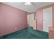 Simple bedroom with green carpet and built-in closet at 754 Firestone Ln, Sanford, NC 27330