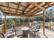 Relax on this covered deck with firepit and seating at 754 Firestone Ln, Sanford, NC 27330