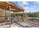 Relaxing deck with wooded views, ceiling fan, and seating area at 754 Firestone Ln, Sanford, NC 27330