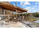 Covered deck with seating area and scenic wooded views at 754 Firestone Ln, Sanford, NC 27330