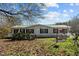 House exterior with large yard and trees at 754 Firestone Ln, Sanford, NC 27330