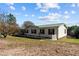 Single-story home with green roof and deck at 754 Firestone Ln, Sanford, NC 27330