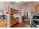 Kitchen features wood cabinets, stainless steel appliances, and an eat-in area at 754 Firestone Ln, Sanford, NC 27330