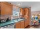 View of kitchen sink and appliances with access to laundry area at 754 Firestone Ln, Sanford, NC 27330