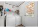 Laundry room with washer, dryer, and storage shelves at 754 Firestone Ln, Sanford, NC 27330