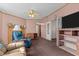 Living room with TV, built-in shelving and a fireplace at 754 Firestone Ln, Sanford, NC 27330