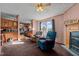 Living room features a fireplace,recliner chairs, and built-in shelving at 754 Firestone Ln, Sanford, NC 27330