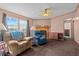 Tan and blue recliners, fireplace, and built-in shelving in living room at 754 Firestone Ln, Sanford, NC 27330