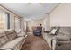 Open concept living room with ample seating and natural light at 754 Firestone Ln, Sanford, NC 27330