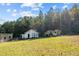 Property features multiple outbuildings and a barn at 754 Firestone Ln, Sanford, NC 27330