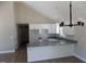 Bright, open kitchen with granite countertops and white cabinets at 104 Halifax Rd, Louisburg, NC 27549