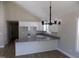 Bright, open kitchen with granite countertops and white cabinets at 104 Halifax Rd, Louisburg, NC 27549
