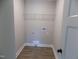 Laundry room with washer and dryer hookups and wood-look vinyl flooring at 104 Halifax Rd, Louisburg, NC 27549