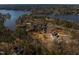 Stunning aerial view of waterfront homes surrounded by lush greenery at 1119 Sagamore Dr, Louisburg, NC 27549