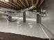 Encapsulated basement with a vapor barrier on walls and floor to provide a dry storage space at 1119 Sagamore Dr, Louisburg, NC 27549