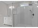 Modern bathroom featuring decorative shower tile, shower head, and white vanity with a mirror at 1119 Sagamore Dr, Louisburg, NC 27549