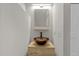 Bathroom with a unique glass bowl sink, modern faucet, and wood vanity at 1119 Sagamore Dr, Louisburg, NC 27549