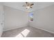 Cozy carpeted bedroom with a window providing natural light and a ceiling fan at 1119 Sagamore Dr, Louisburg, NC 27549