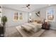 Bright bedroom with large windows and a comfortable bed with neutral decor at 1119 Sagamore Dr, Louisburg, NC 27549