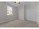 Neutral bedroom with carpet, a window providing natural light, and a closet with sliding doors at 1119 Sagamore Dr, Louisburg, NC 27549
