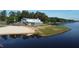 Stunning lakefront building with beach access and an outdoor gathering space, perfect for recreational activities at 1119 Sagamore Dr, Louisburg, NC 27549