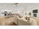 Open-concept living room featuring a kitchen, fireplace, and access to a patio at 1119 Sagamore Dr, Louisburg, NC 27549