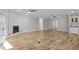 Spacious living room with beautiful wood floors, fireplace, and plenty of natural light at 1119 Sagamore Dr, Louisburg, NC 27549